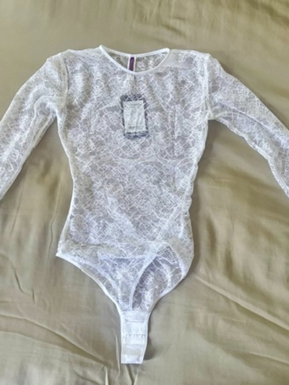 Maison Close: white lace, long-sleeved bodysuit
